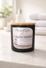 Clean Linen Candle from Phoenix Crafted in a stylish black jar with a wooden lid, ideal for freshening up spaces.