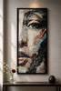 Artistic portrait of a woman's face in vibrant colors displayed in a modern interior setting.
