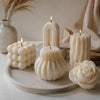 Decorative Candles That Actually Smell Good: How to Choose Beauty, Fragrance, and Performance featuring stylish sculptural designs.