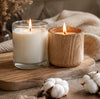Wood Wick vs. Cotton Wick Candles: Burn, Sound, Care, and Which Is Right for You with lit candles on a wooden surface.