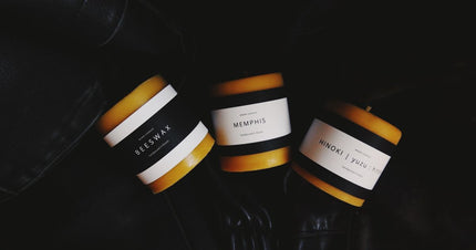 Beeswax candles and wax materials arranged for an educational guide.