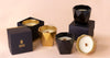 Luxury candles arranged on a neutral surface for a quality and value comparison.