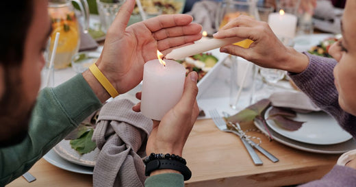 Lit candle illustrating burn time, wax use, and long-term value.