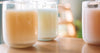Soy wax candle and materials arranged for an educational wax guide.