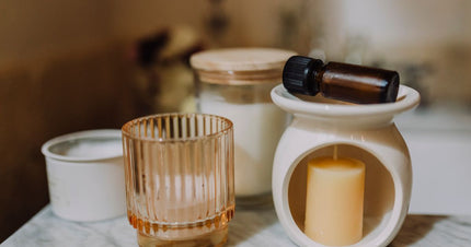 Fragrance materials and candle-making supplies arranged for an educational guide.
