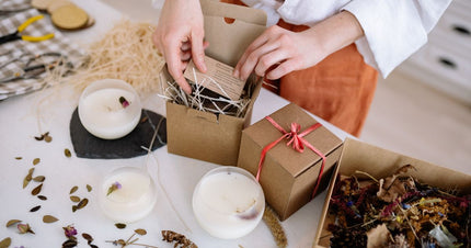 Candle, packaging, and natural materials arranged for a sustainability-claims guide.