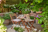 Cozy outdoor seating area with potted plants, perfect for enjoying best coconut soy candles 2026.