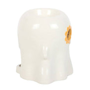 White glossy ceramic ghost-shaped wax warmer with orange-yellow sunflower motif on the right, top bowl opening visible.
