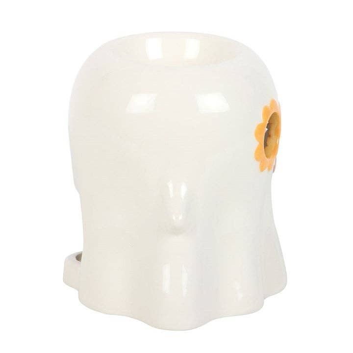 White glossy ceramic ghost-shaped wax warmer with orange-yellow sunflower motif on the right, top bowl opening visible.