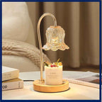 Lily of the Valley solid wood candle warmer lamp illuminating a scented candle on a stylish table.