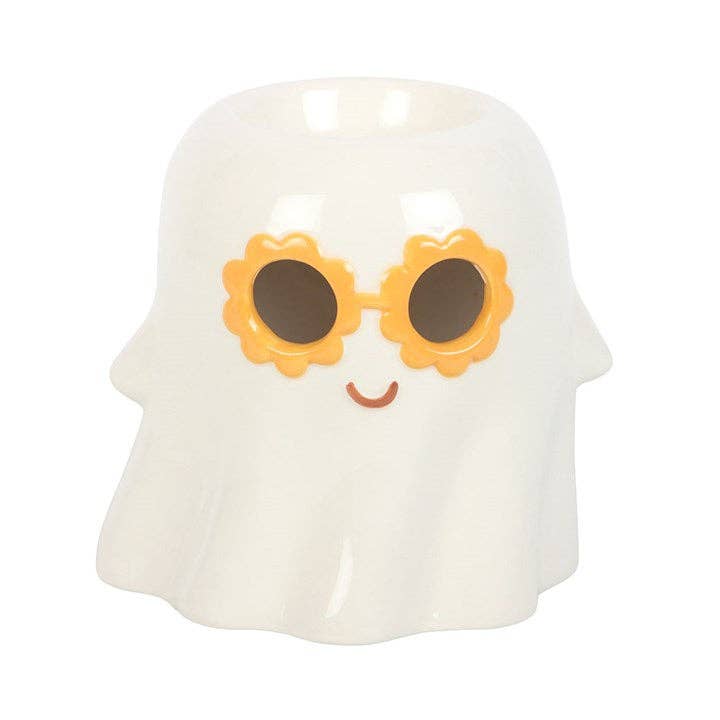 Glossy white ceramic ghost-shaped wax warmer with orange flower-shaped sunglasses, black lenses and small brown smile, hollow top opening.