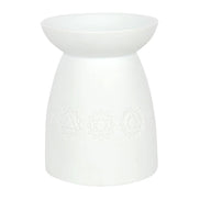 White Ceramic Seven Chakra Tealight Wax Warmer features a sleek design and chakra symbols for aromatic infusion.