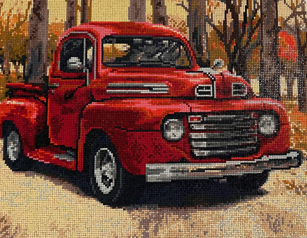 Autumn Haul Diamond Painting of a vintage red truck in a fall scene surrounded by trees and autumn colors.