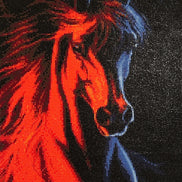 Close-up diamond painting of a stallion head with fiery red mane and blue face on a black mosaic of reflective round drills.