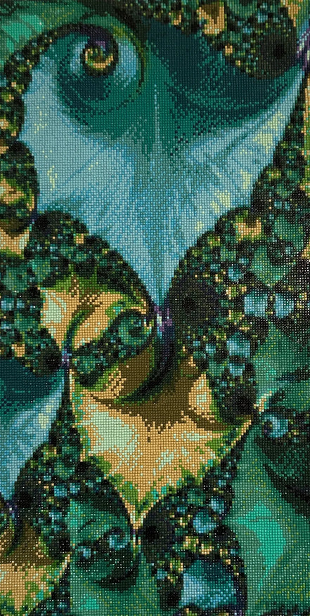 Close-up diamond painting with a grid of square drills forming emerald, teal and aqua spirals with gold and dark-green accents