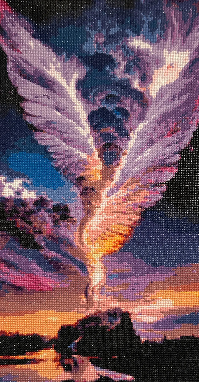 Vertical diamond-painting mosaic of an ascending winged figure with pink and purple wings, blue clouds, and orange sunset reflected on water