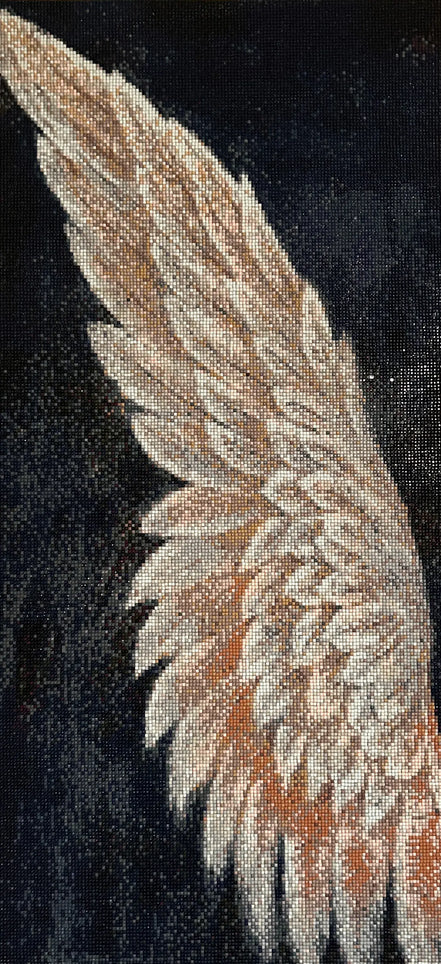 Close-up diamond painting canvas of a beige, cream, and copper feathered wing against a black background