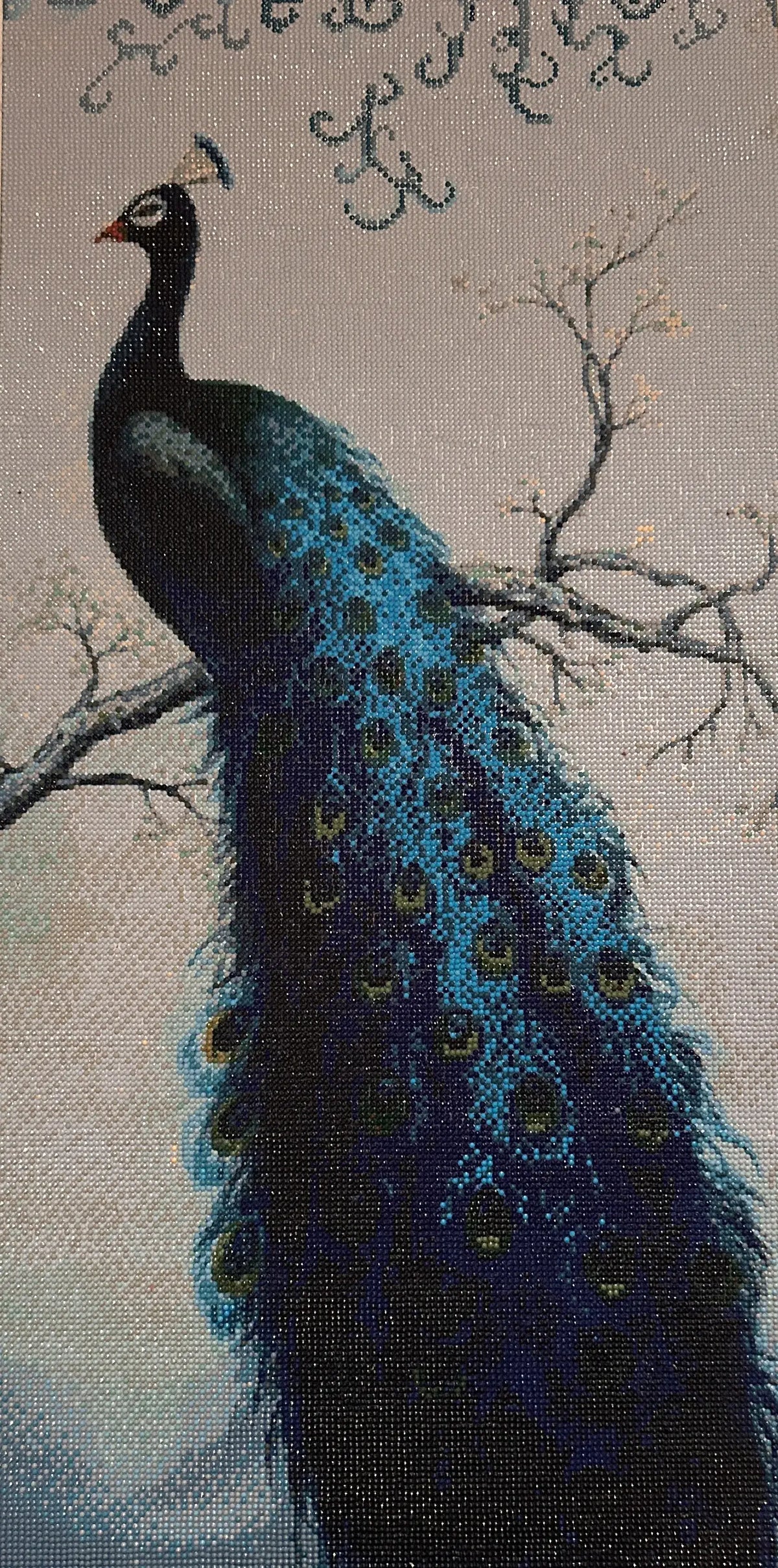 Azure Crest Peacock Diamond Painting featuring a majestic peacock on a branch with shimmering blue and green feathers.