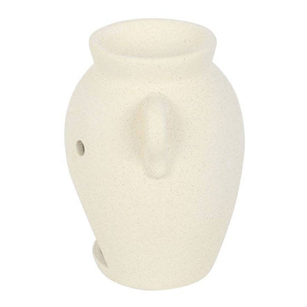 Cream-speckled vase-shaped wax warmer with a shallow top bowl, single small side hole and lower front opening on a rounded textured body