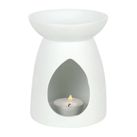 White ceramic tea-light wax warmer with shallow bowl top, teardrop front opening revealing a lit metal tealight and small flame.