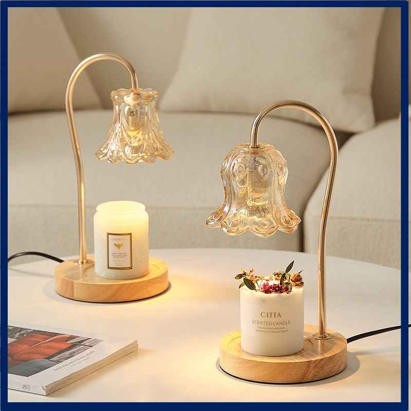 Lily of the Valley Solid Wood Candle Warmer Lamp with dimmable ambient light and floral scented candles on a table.