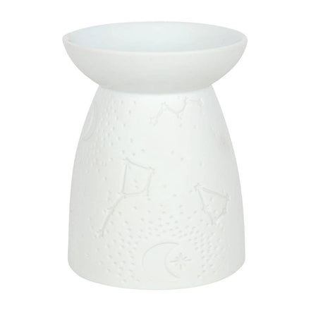 Matte white ceramic tealight warmer, front view; shallow top bowl on a conical base embossed with constellations, stars, and a crescent moon.