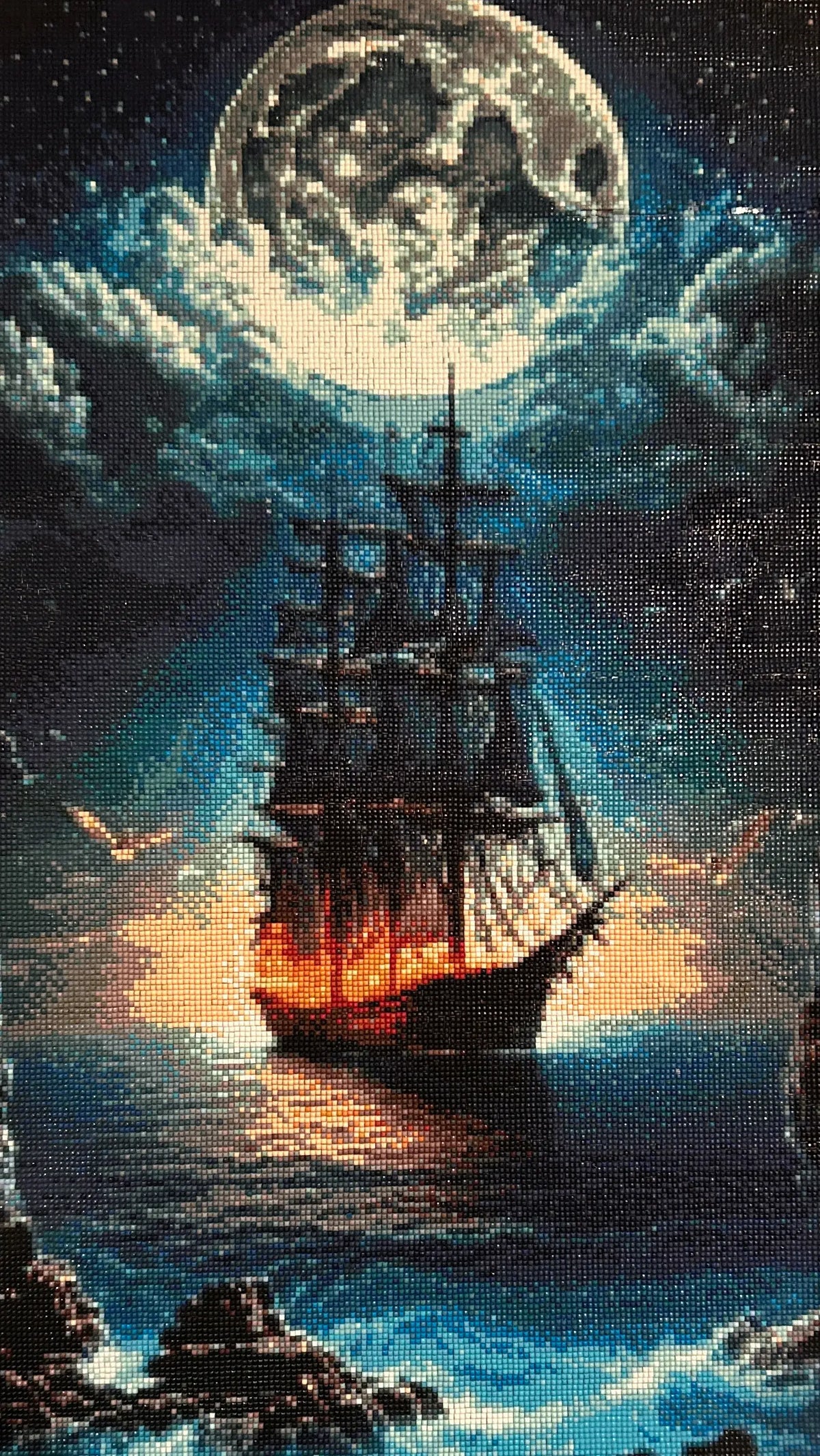 Moonfire Voyage Diamond Painting of a glowing ship against a dramatic night sky and ocean.