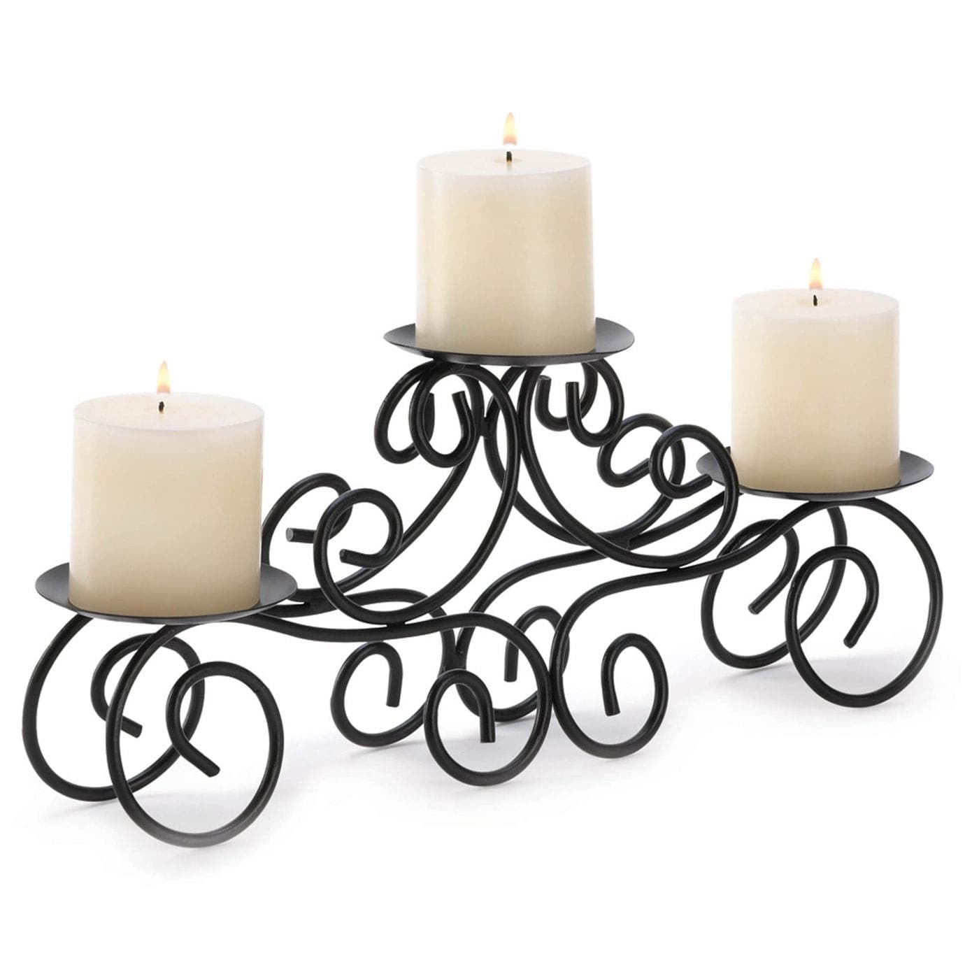 Black metal scrollwork candle centerpiece with three lit white pillar candles on staggered round trays.