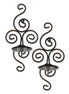 Pair of dark metal scrollwork wall sconces with round candle trays and rear hanging loops on a white background.