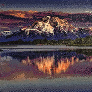 Sunset over Still Waters Diamond Painting featuring vibrant sunset skies and snow-capped mountains reflecting on the lake.