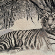 Grayscale diamond-painting close-up of a reclining tiger in a snowy forest, visible square drills and sparkling facets.