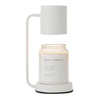 Modern Dimmable Candle Warmer Lamp warming a jar candle in a stylish metal design.