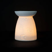 White Ceramic Constellation Tealight Wax Warmer featuring celestial design and warm glow.