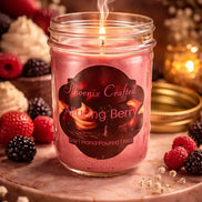 Alluring Berry Candle in a mason jar with a glowing flame, surrounded by fresh berries and floral accents.