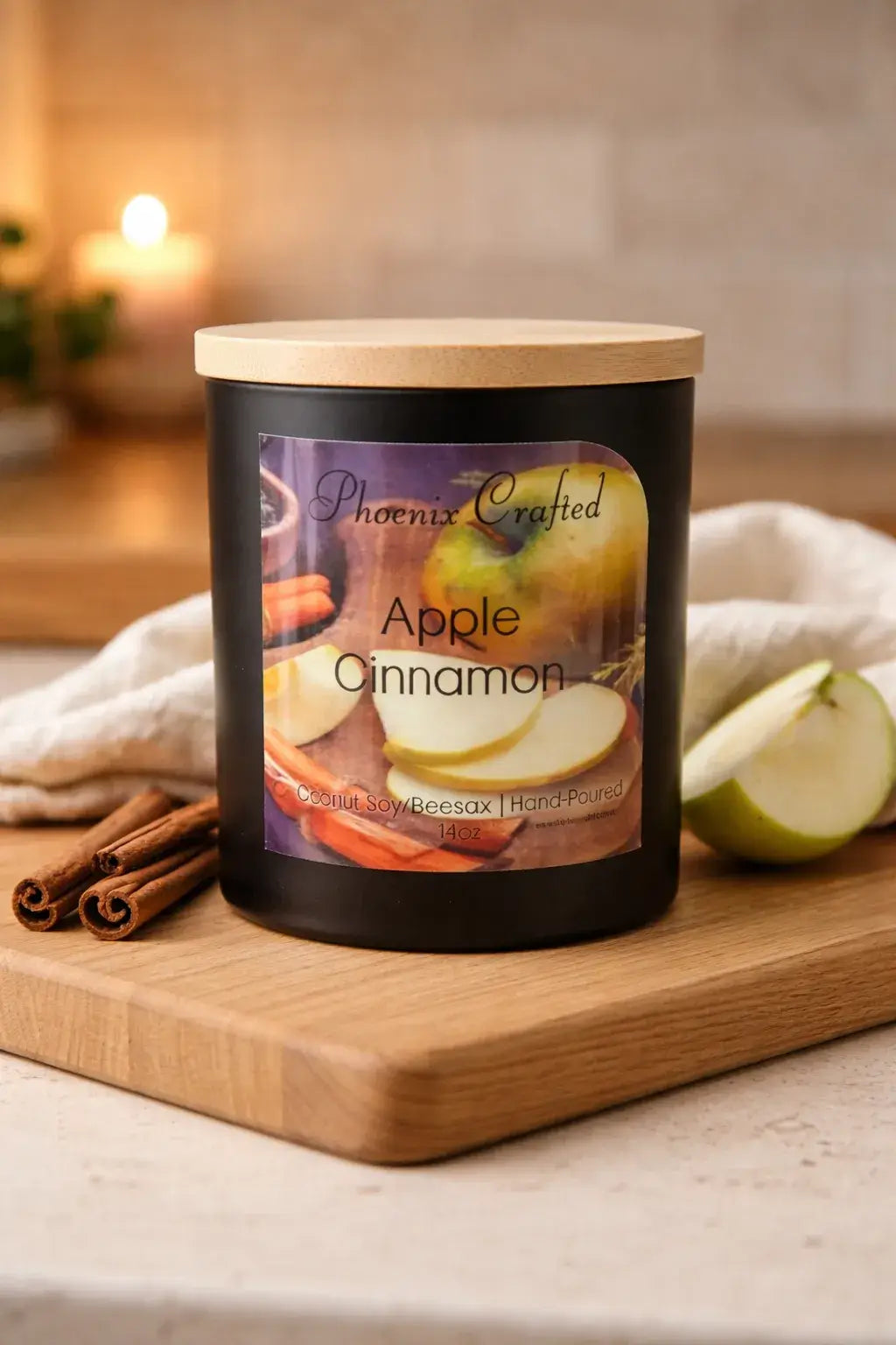 Apple Cinnamon Candle in a stylish black jar with wooden lid, featuring apples and cinnamon sticks.