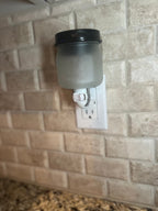 Plug in wax warmers with fragrance melts showcased in a stylish kitchen setting.