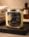 Bergamot & Mint Candle in a glass jar on a tray with towels, reflecting a fresh and clean atmosphere.