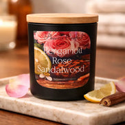 Bergamot Rose & Sandalwood Candle on a marble tray with lemon and rose petals, creating an elegant floral-wood ambiance.