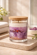Black Cherry Vanilla Candle showcased in a clear glass jar with a wooden lid, set on a natural stone tray.