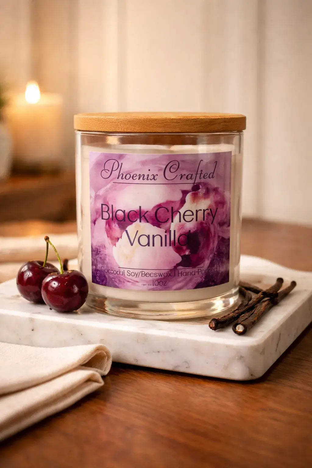 Black Cherry Vanilla Candle in a glass jar with cherries and vanilla sticks, perfect for cozy home atmospheres.