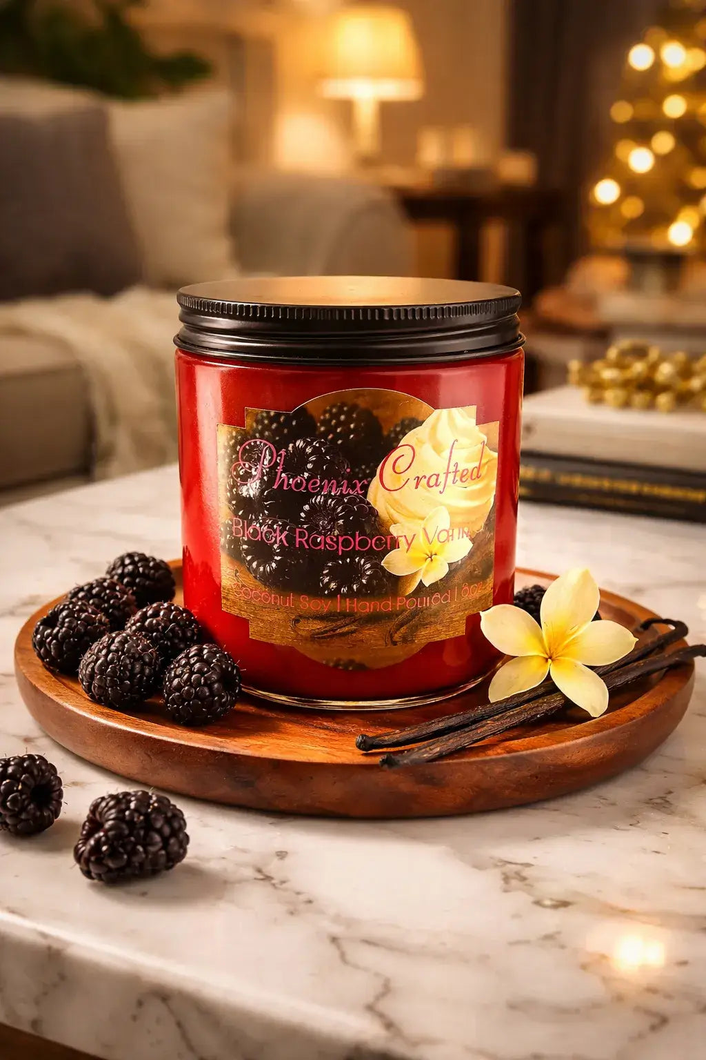 Black Raspberry Vanilla Candle on a wooden tray surrounded by black raspberries and vanilla flowers.