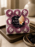 Black Raspberry Vanilla Tealights in a decorative pack, perfect for creating a cozy ambiance with fruity sweetness.