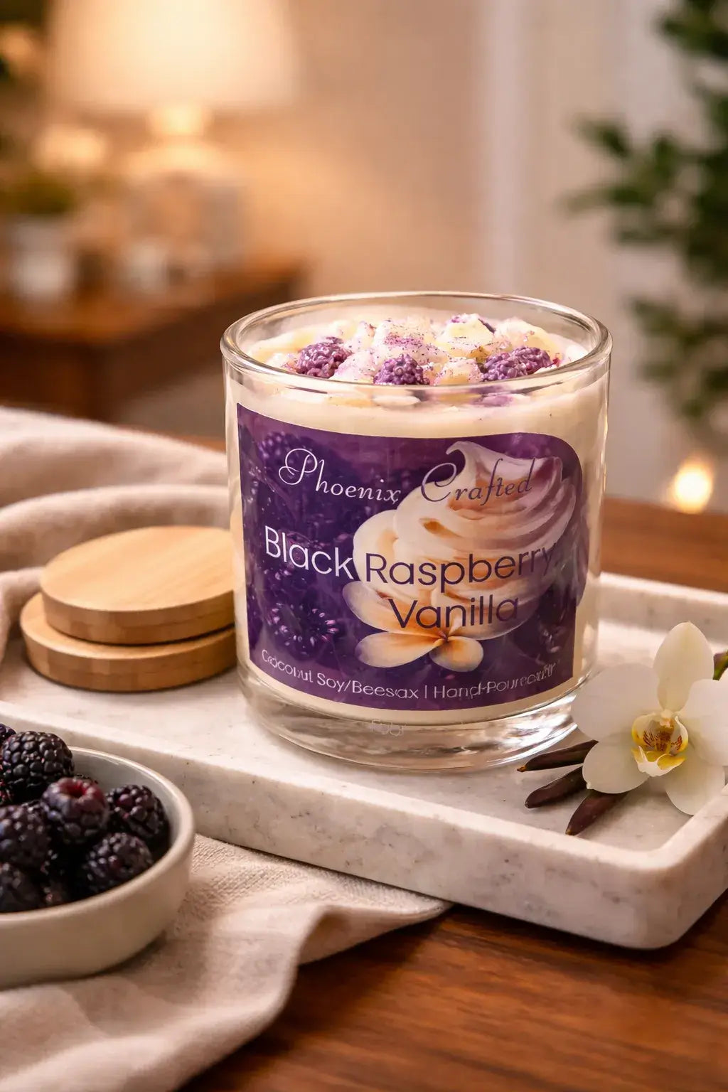 Luxurious Black Raspberry Vanilla Candle featuring ripe black raspberries and creamy vanilla, displayed with blackberries.