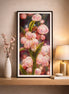 Blossom Glow Diamond Painting displayed on a shelf, featuring vibrant pink flowers and green leaves in a stylish setting.