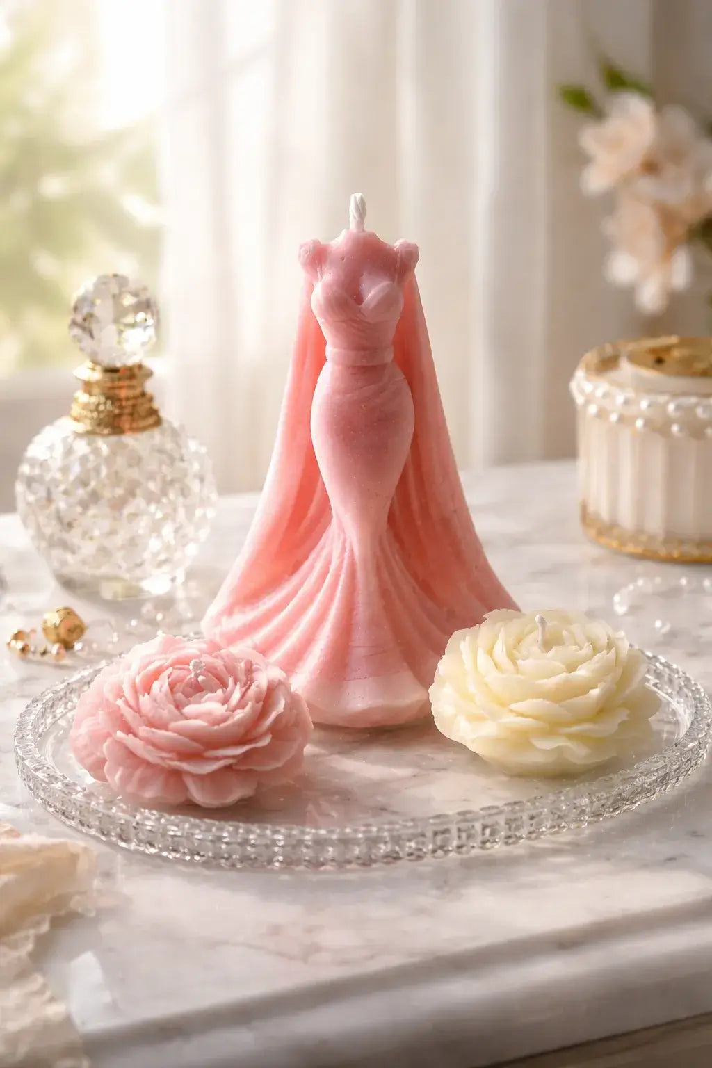 Decorative Bohemian Rose Candles featuring a pink gown candle and floral accents on a crystal plate.