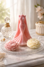 Decorative Bohemian Rose Candles featuring a pink gown candle and floral accents on a crystal plate.