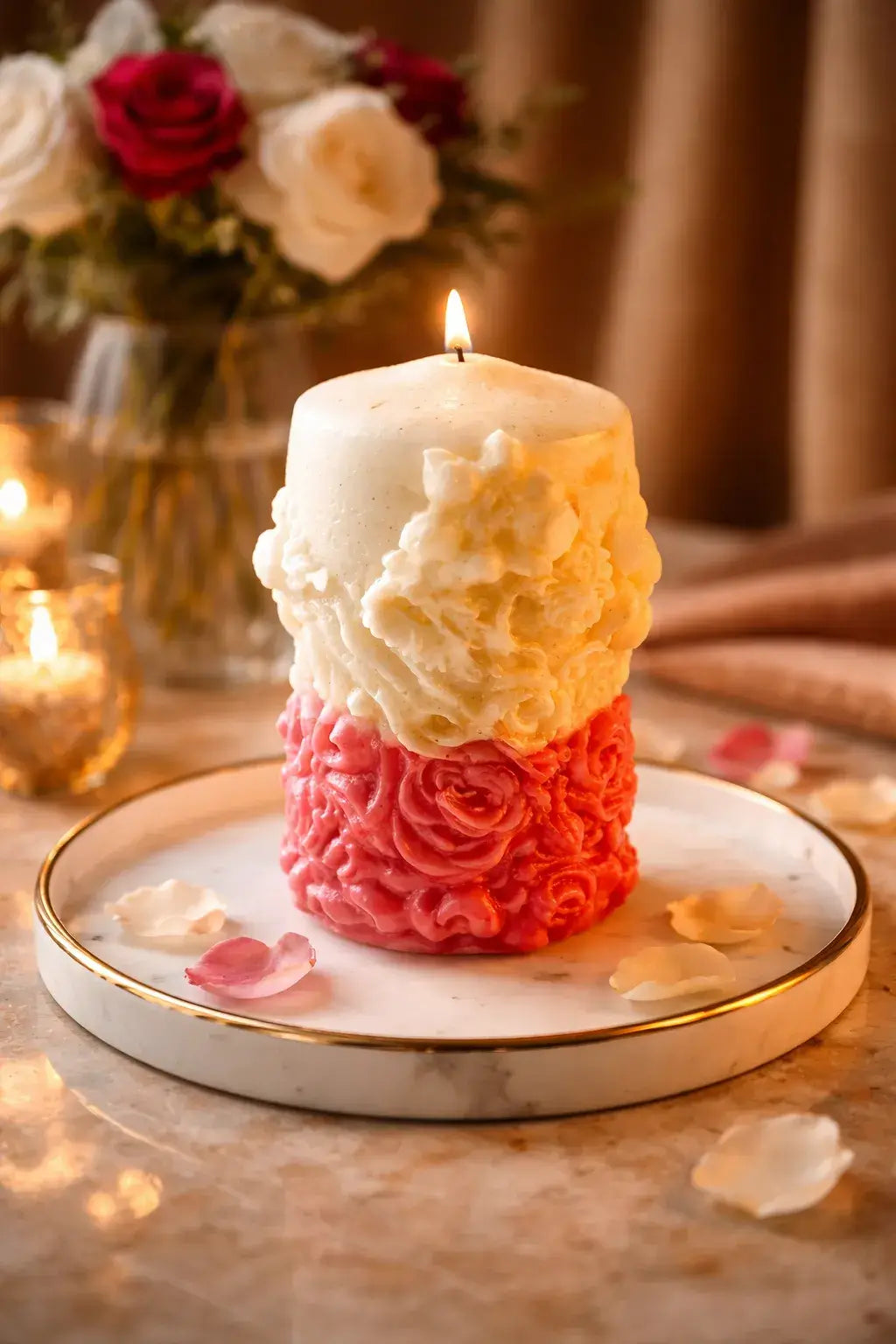 Decorative Bohemian Rose Candles on a marble plate, featuring intricate floral designs and a lit wick, creating a warm atmosphere.