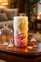 Decorative Bohemian Rose Candles with floral design on a wooden table in a cozy, serene room.