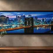Brooklyn Bridge Nights finished cityscape diamond artwork shown in a wide frame mockup; artwork is sold unframed.