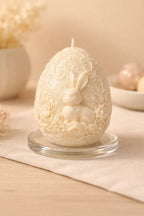 Whimsical Bunny Egg Candle with detailed bunny and floral carvings, perfect for Easter décor and spring styling.
